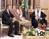 CAPTION:--the attached photo was taken during President Bush's January 2000 trip to Saudi Arabia. It is of President Bush with King Fahd and Prince Bandar (center). Former First Lady Barbara Bush is seen at left. This picture was made at the Royal court.